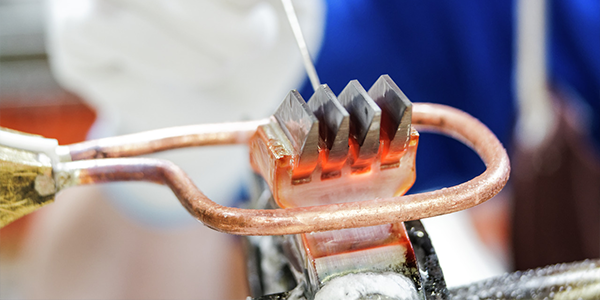 An image of Carbide tips being sharpened and replaced on a tool body