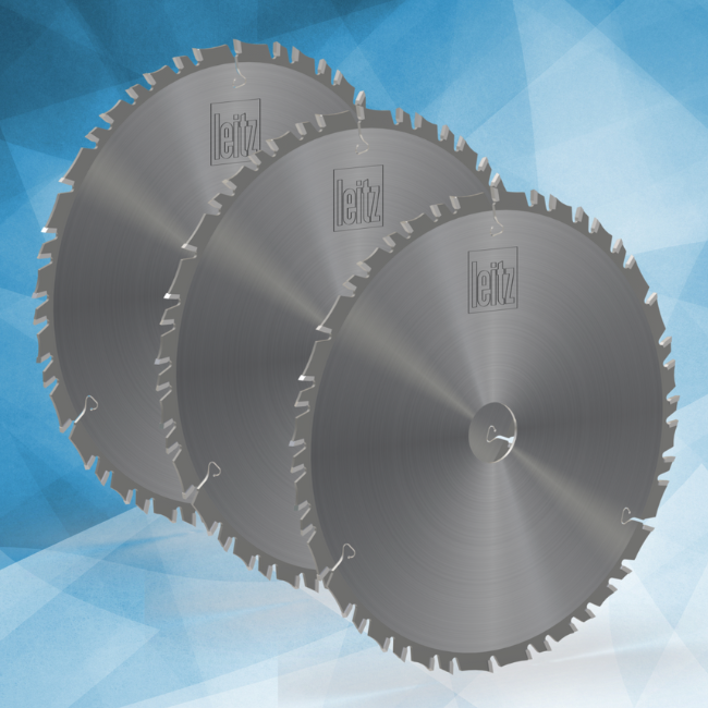 A selection of three circular saw blades including three portable saw blades on a light blue background