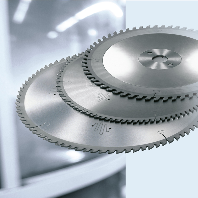 A selection of three Leitz carbide saw blades on a light Gray background