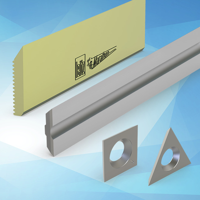 A selection on knives and blades on a light blue background including turnblade knives, planer blades and triangular spurs